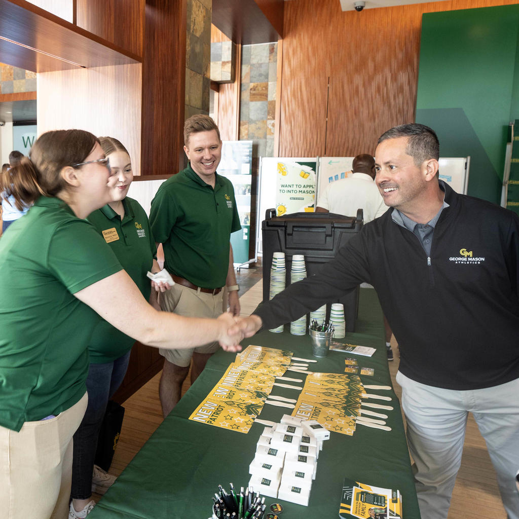 George Mason Provost James Antony meets new first year students and families during move-in on the Fairfax Campus.
